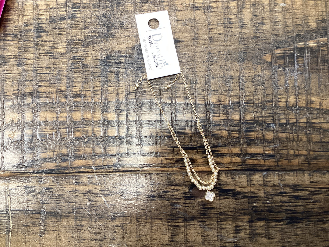 Dorothy  gold bracelet  double with clover pendant